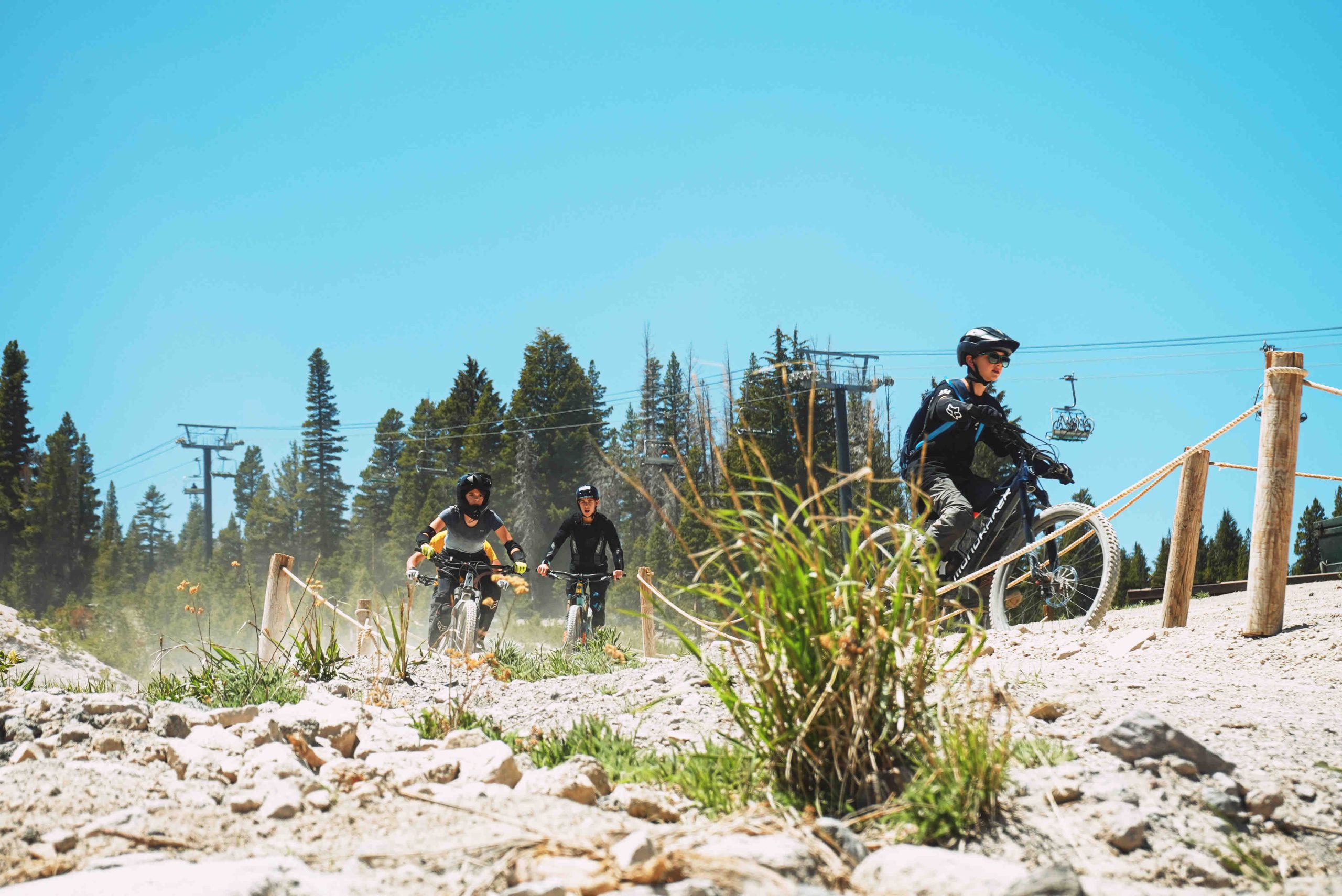 The Panorama Gondola running up Mammoth Mountain against a deep blue summer sky